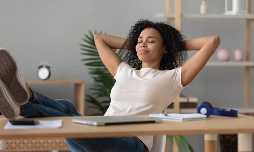 Lady sitting at a table relaxed