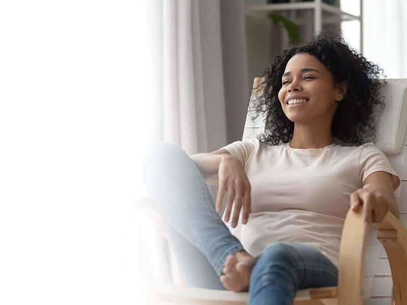 Lady sitting on a chair relaxed