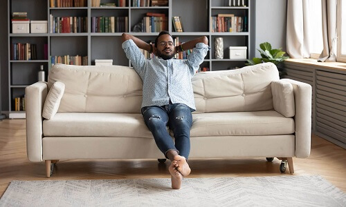 Man sitting on a couch relaxed