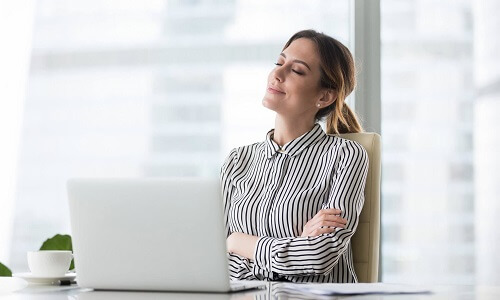 Women sitting in front of a laptop