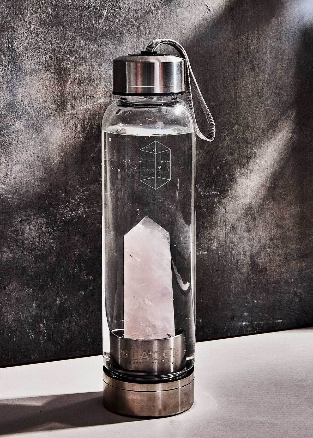 glass water bottle with a crystal inside