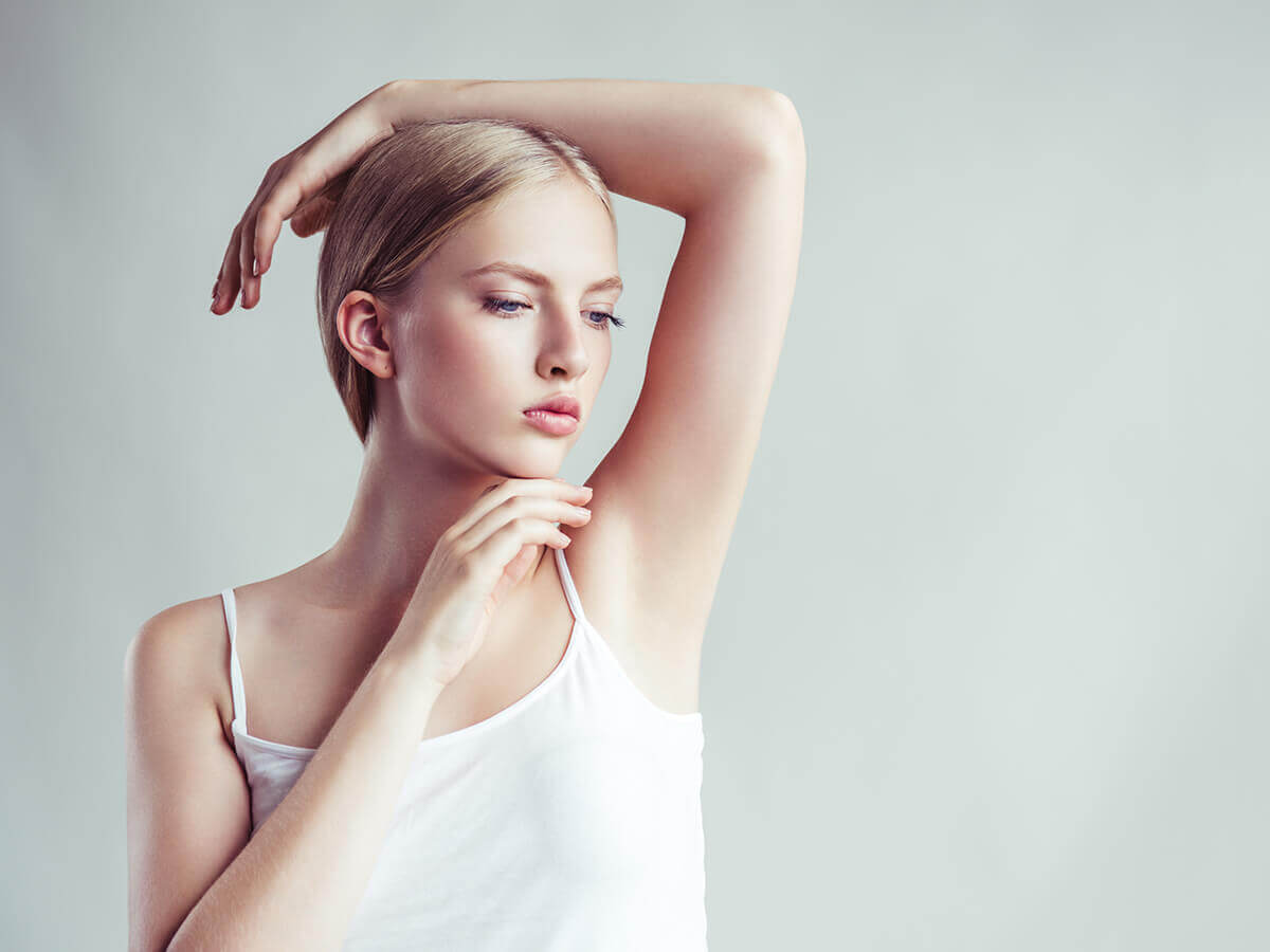 CBD deodorant-woman thinking about armpits.