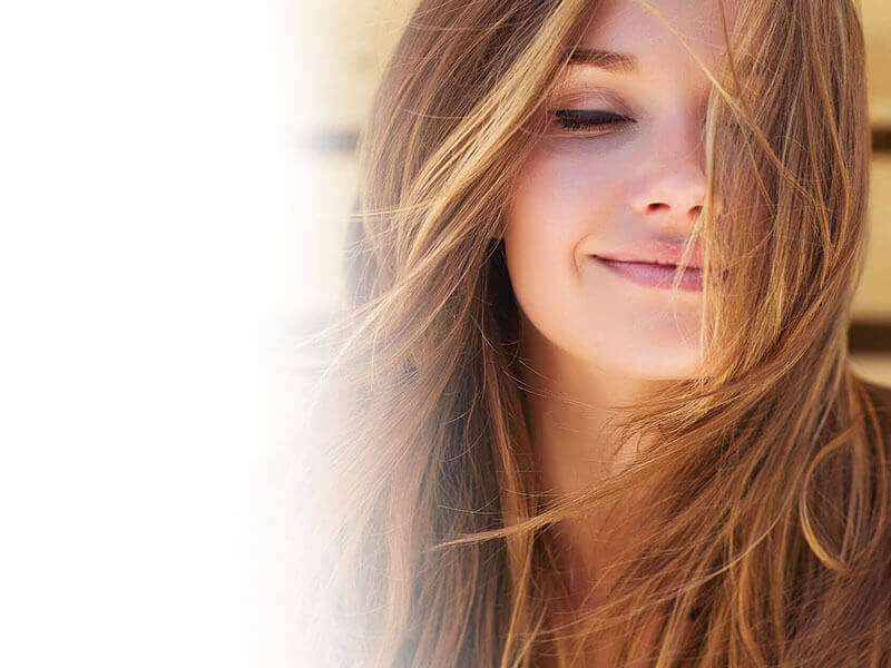 Smiling girl in the wind