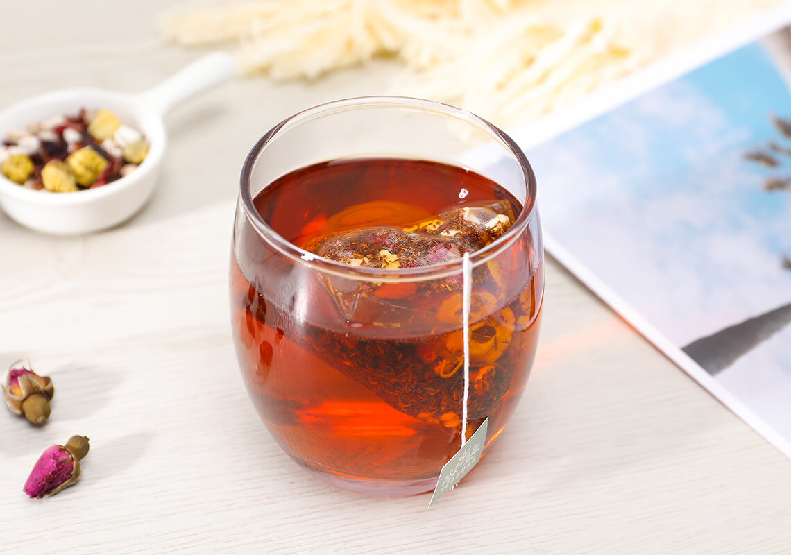 cup of tea with tea bag in glass cup