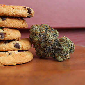 stack of cookies next to hemp bud