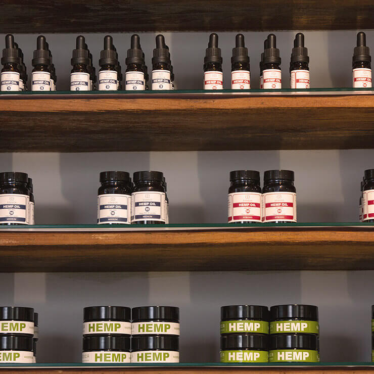 Display of CBD and hemp products on wooden shelves