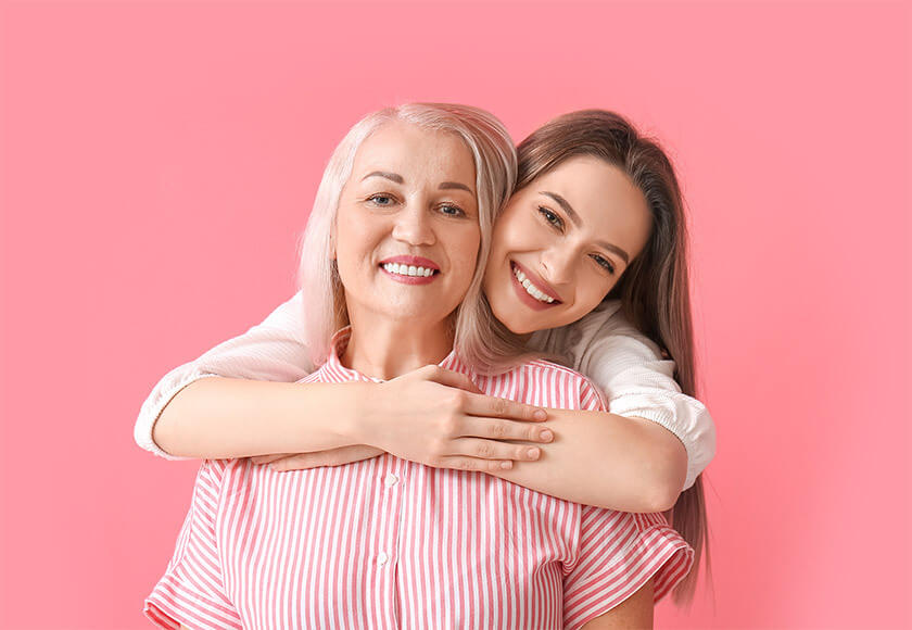 Mother and daughter hugging