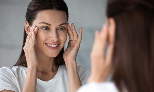 Woman looking in a mirror