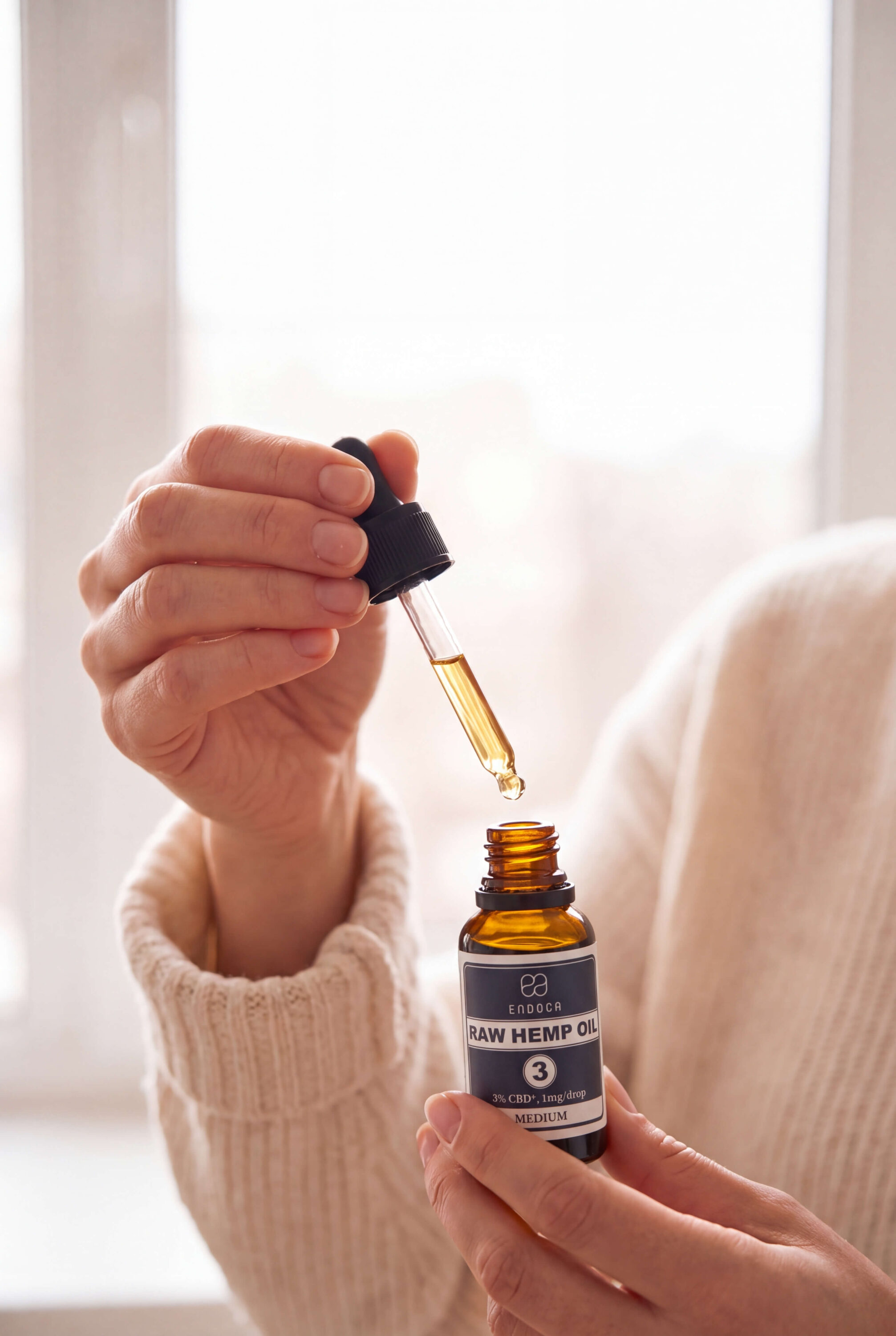endoca-routine-dropper-in-hand-by-window-branded-01