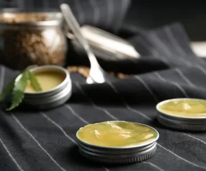 Containers with hemp lotion on striped fabric